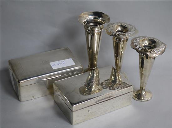 Two George V silver cigarette boxes and thee vases.